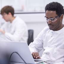 Scientist working on a laptop