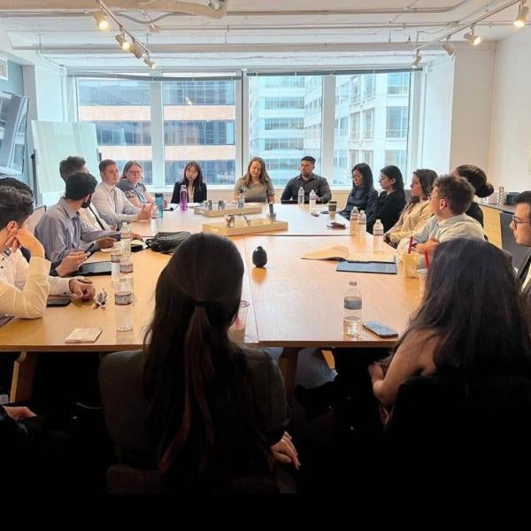 students sitting around conference table