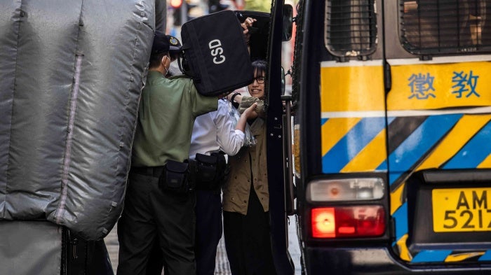 Chow Hang-tung (R) arrives at the Court of Final Appeal in Hong Kong on June 8, 2023.