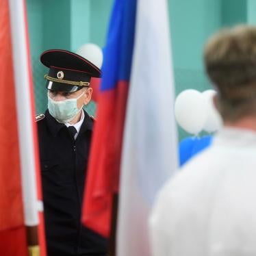 Police officer wearing face mask stands on duty at the polling station on July 1, 2020 in St. Petersburg, Russia.