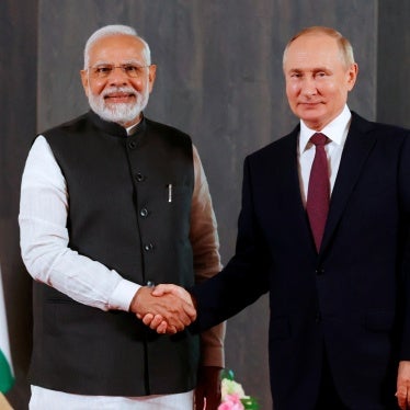 Russian President Vladimir Putin, right, and Indian Prime Minister Narendra Modi pose for a photo shaking hands prior to their talks on the sidelines of the Shanghai Cooperation Organisation (SCO) summit in Samarkand, Uzbekistan, on Sept. 16, 2022.