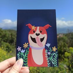 postcard with a cheerful dog in flowers 10.6*15 cm