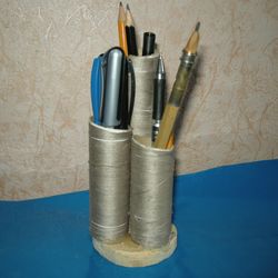 handmade pencil stand pen holder cylinders of different heights on a wooden base