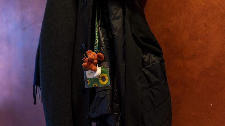 Sunflower lanyard hanging off a jacket