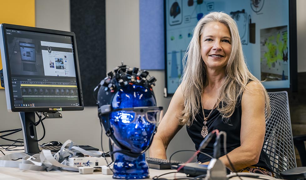 Female scientist working with head mannequin and mind technology