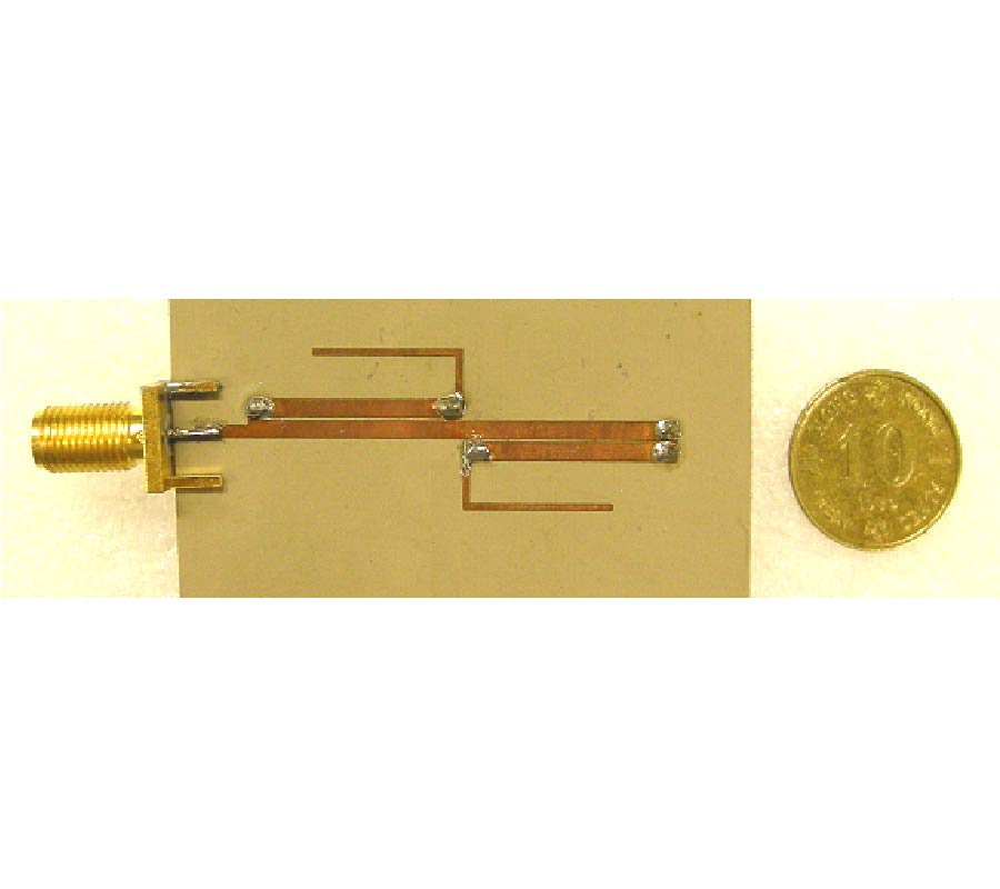 A COMPACT DUAL-BAND COUPLED-LINE BALUN WITH TAPPED OPEN-ENDED STUBS