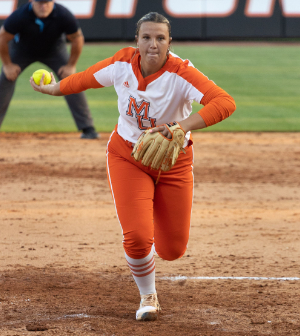 softball pitcher throws the ball