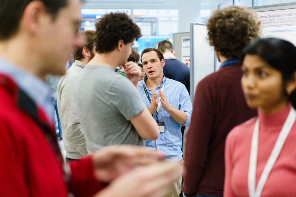 a group of people standing in front of a crowd