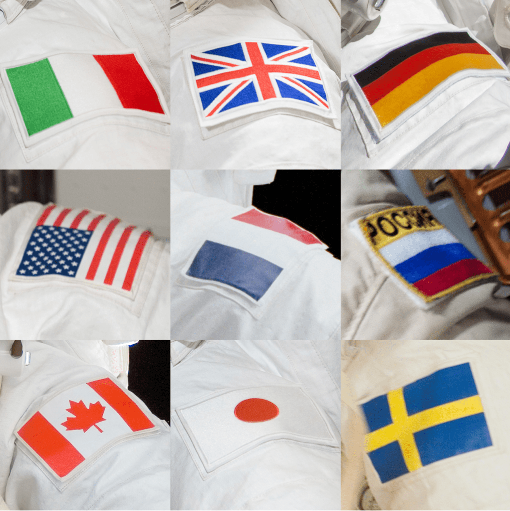 Patches on astronauts shoulders from many different countries