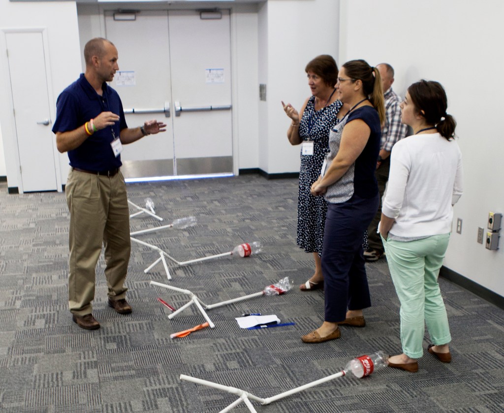 Teachers prepare to demonstrate the projects they built