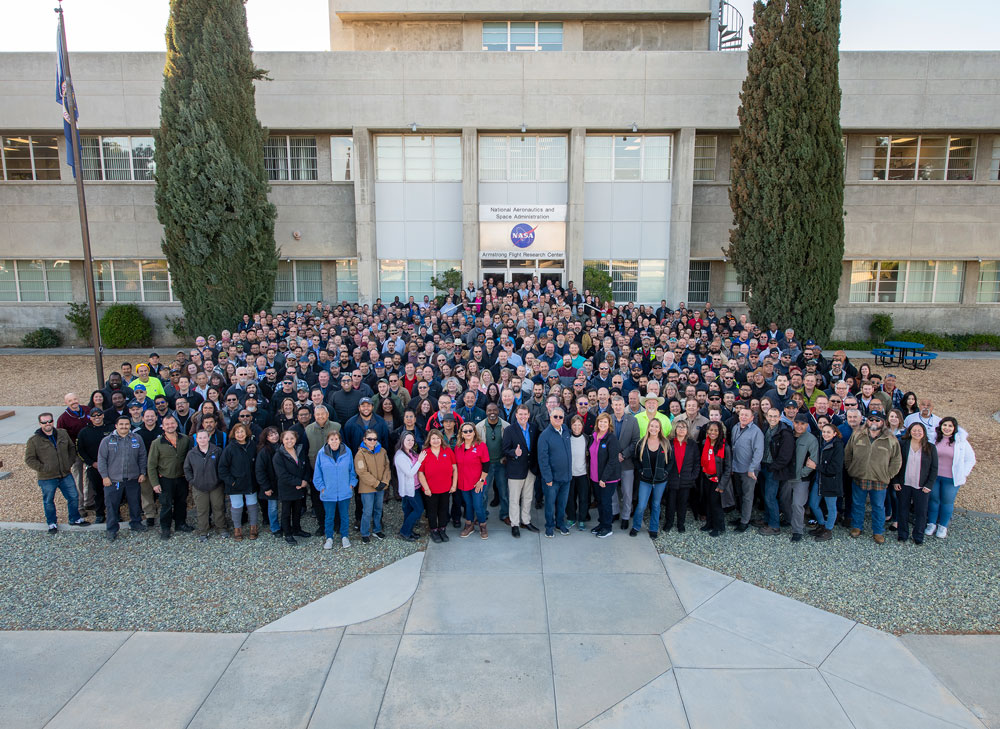 Large group of people standing in front of NASA's Armstrong Flight Research Center's main building.