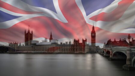 Composite photo of union flag imposed over image of the houses of parliament