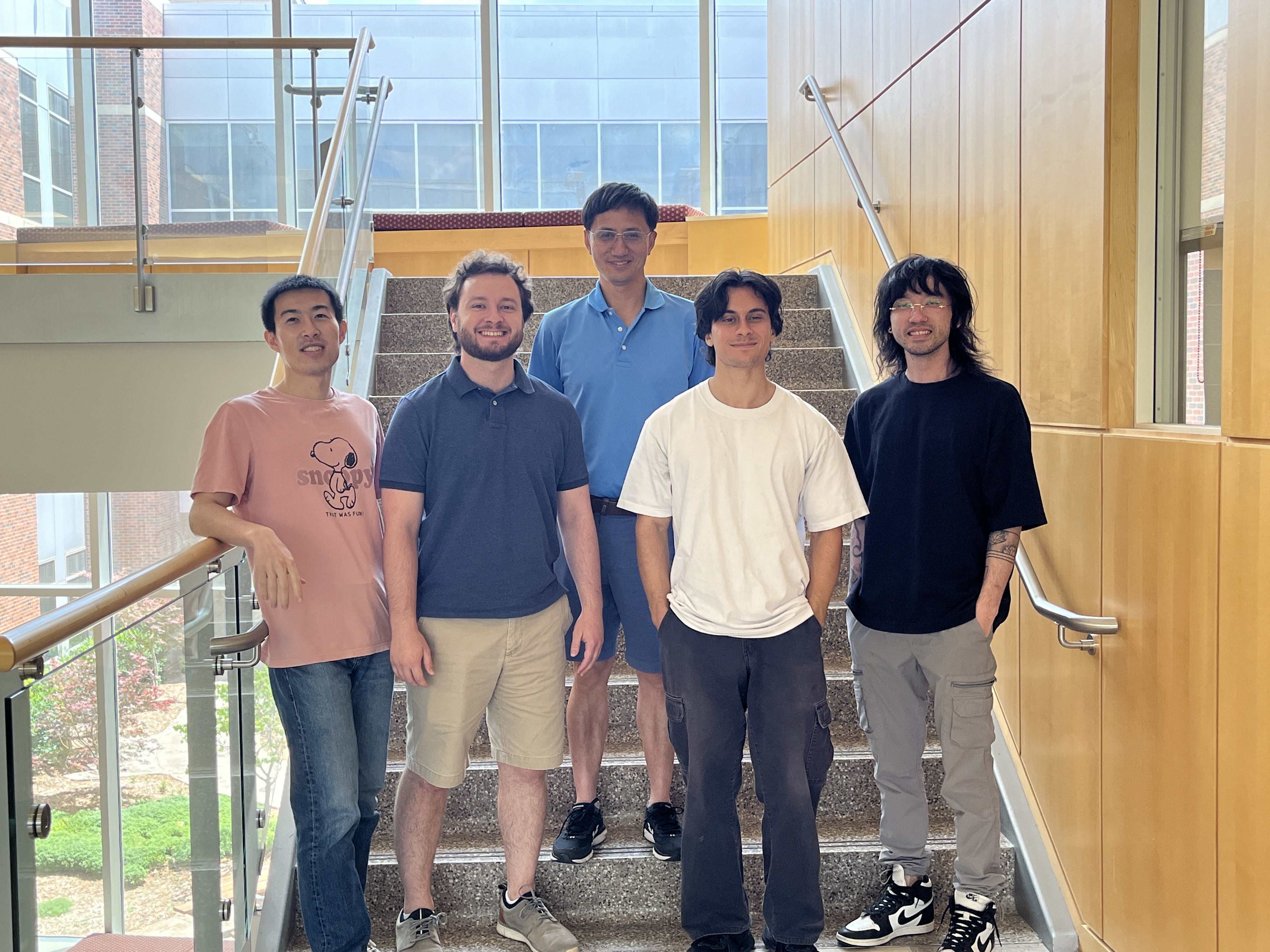 Yihan Shao, back row, with his research team.
