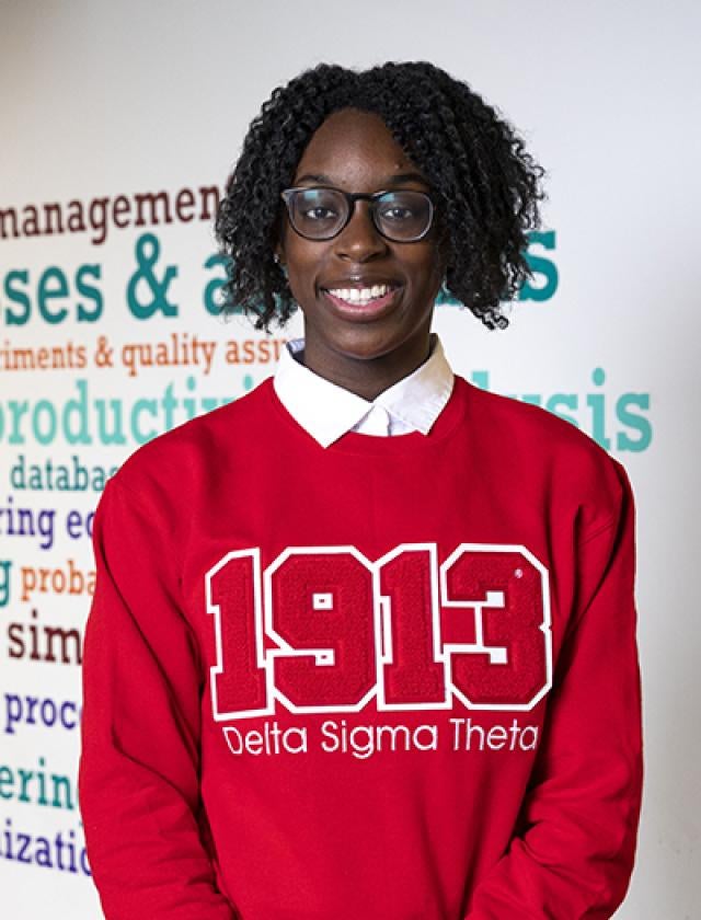 Anaya Joynes in a red Delta Signa Theta shirt