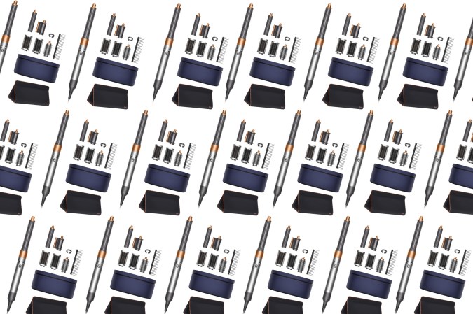 A Dyson Airwrap bundle on a plain background in a pattern