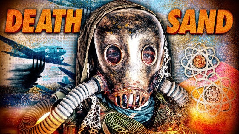 a person in a gas mask with 'death sand' on the screen
