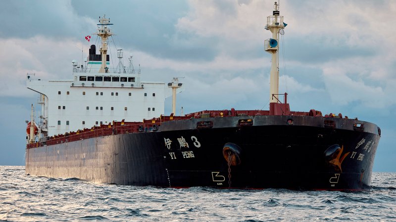 The Chinese ship, the bulk carrier Yi Peng 3 is anchored and being monitored by a Danish naval patrol vessel (unseen) in the sea of Kattegat, near the City og Granaa in Jutland, Denmark, on November 20, 2024. Denmark's navy said on November 20, 2024 it was shadowing a Chinese cargo vessel in the Baltic Sea, a day after Finland and Sweden opened investigations into suspected sabotage of two severed undersea telecoms cables.