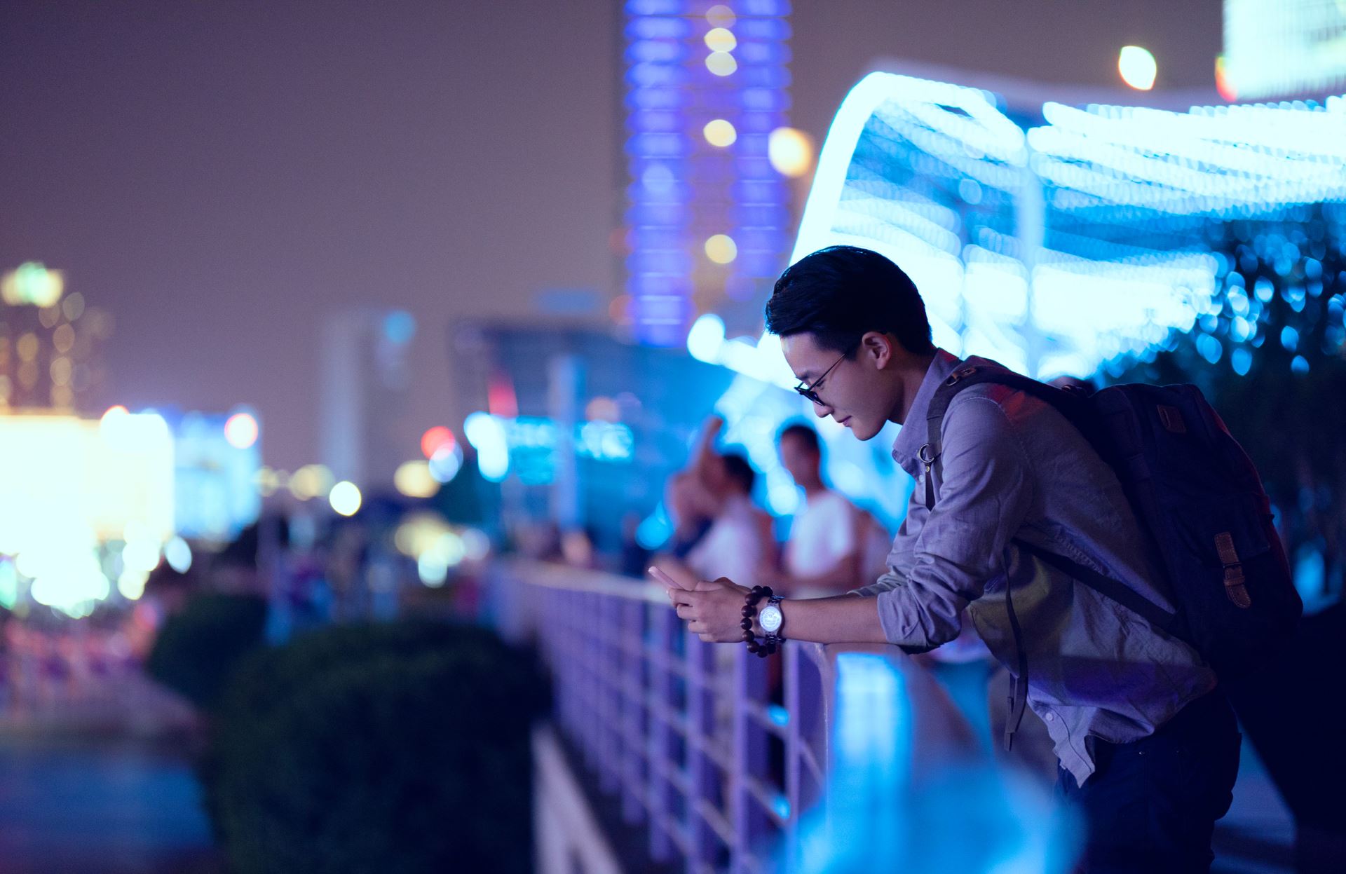 person on the bridge with a phone