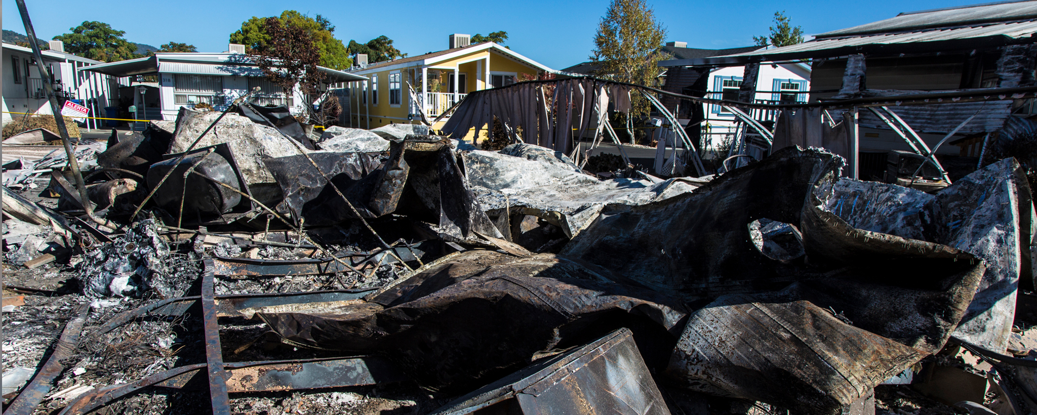 the remains of a house after a fire