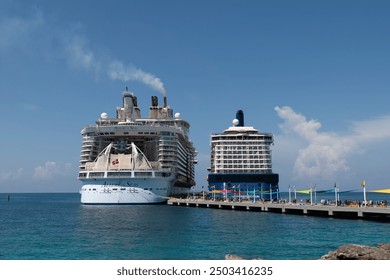 CocoCay, Bahamas - Bahamas: August 10, 2024: Cruise Ships Royal Caribbean Allure of the Seas and Celebrity Cruises Reflection, docked at Royal Caribbean's Private Island, CocoCay, fotografie de stoc