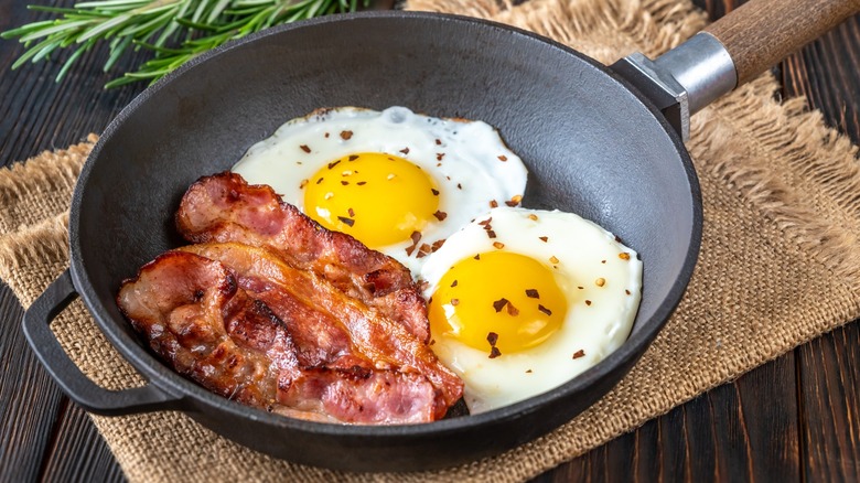 Bacon and eggs in pan