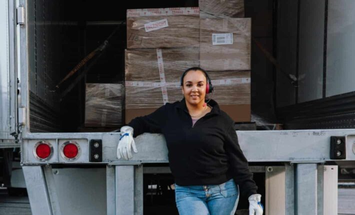 woman in front of truck