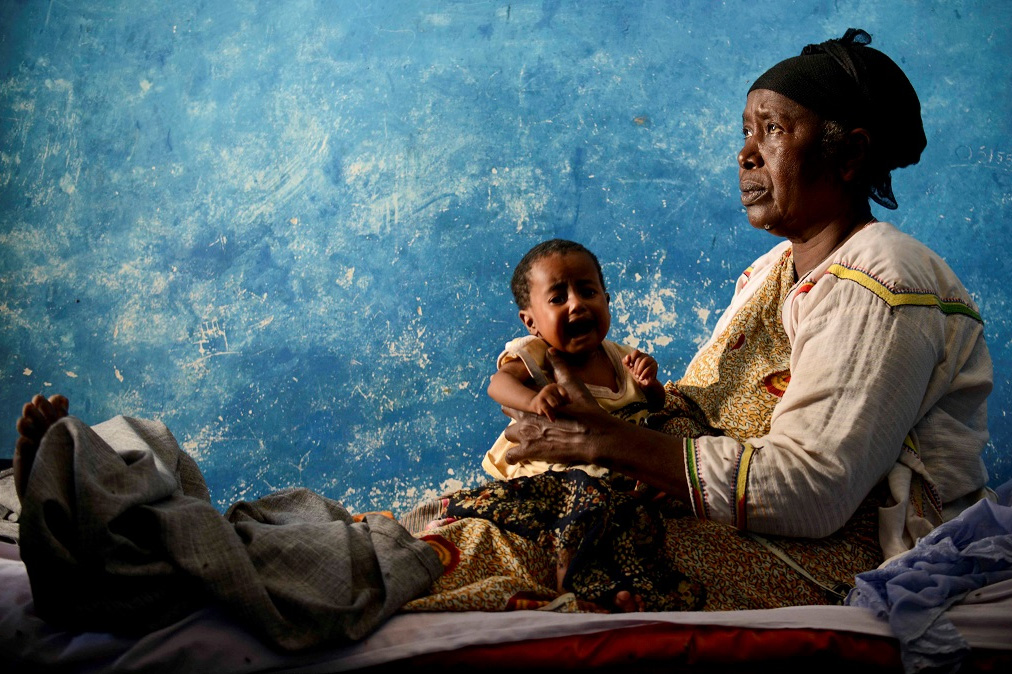 Mother holding a crying baby