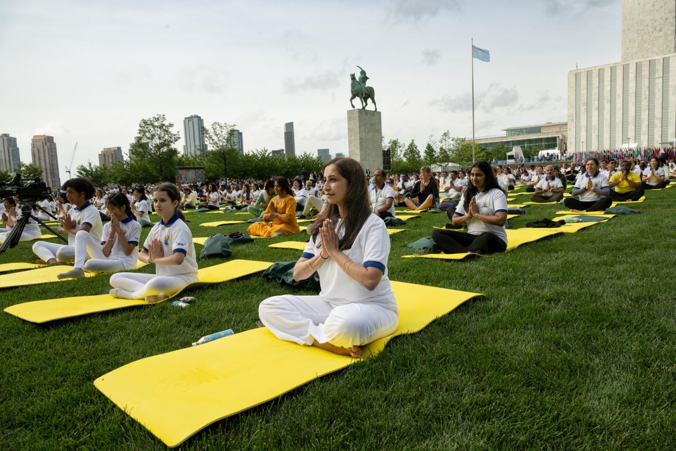 A big crowd gathering outdoors for the International Day of Yoga at UN Headquarters.
