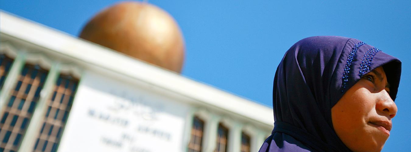 A Muslim woman stands in front of An-Nur Mosque, Timor-Leste's largest, in Dili.