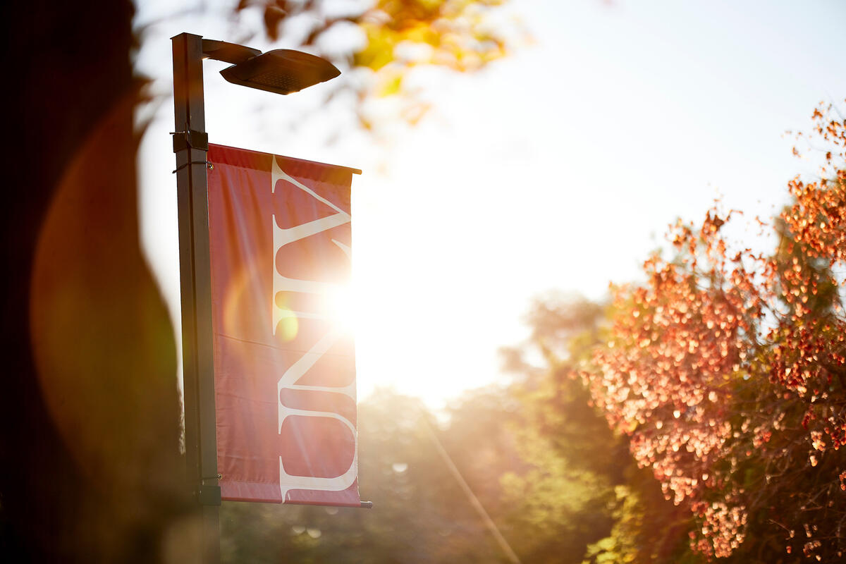 UNLV banner with the sun shining in the background