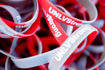 red and gray rubber bracelets with words &quot;UNLV Strong&quot;