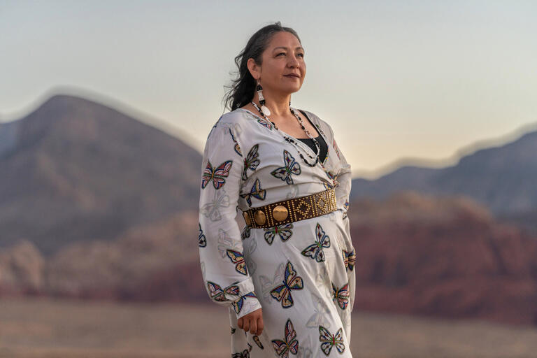 Lynn Manning John poses in the desert facing to her left