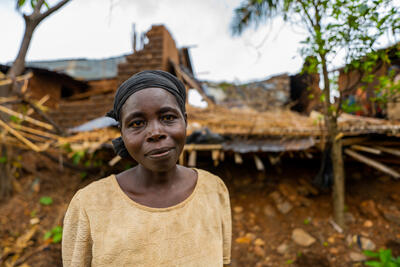 A woman looks into the camera