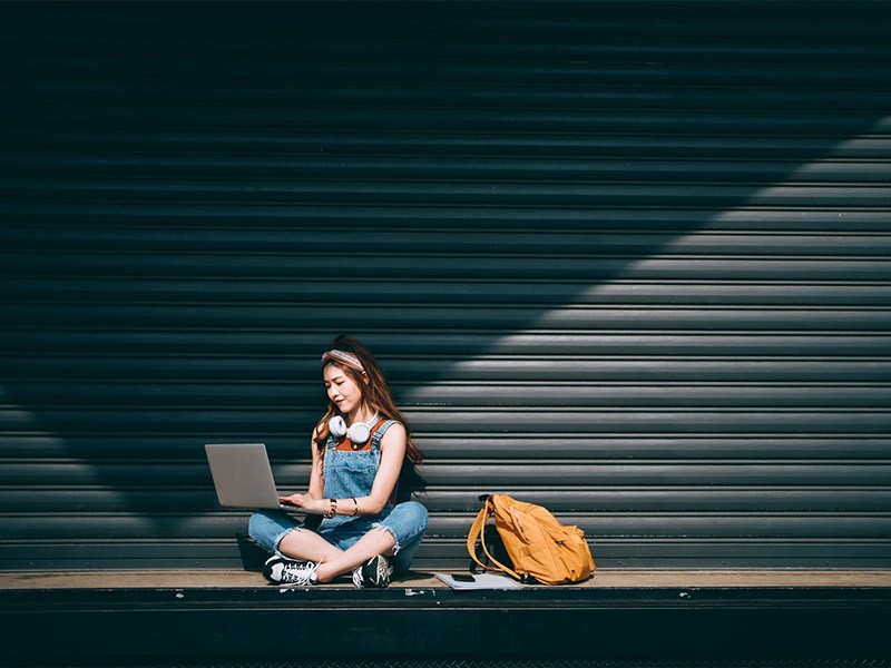 A woman working in a laptop