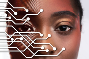 Artificial Intelligence and how it effects Name, Image and Likeness. Circuits encroaching over photo of woman&rsquo;s face.