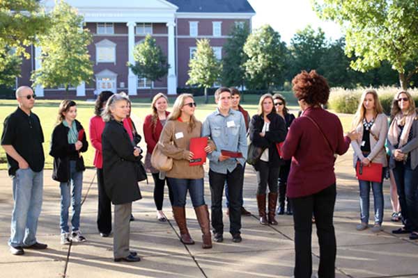 tour guide showing students around