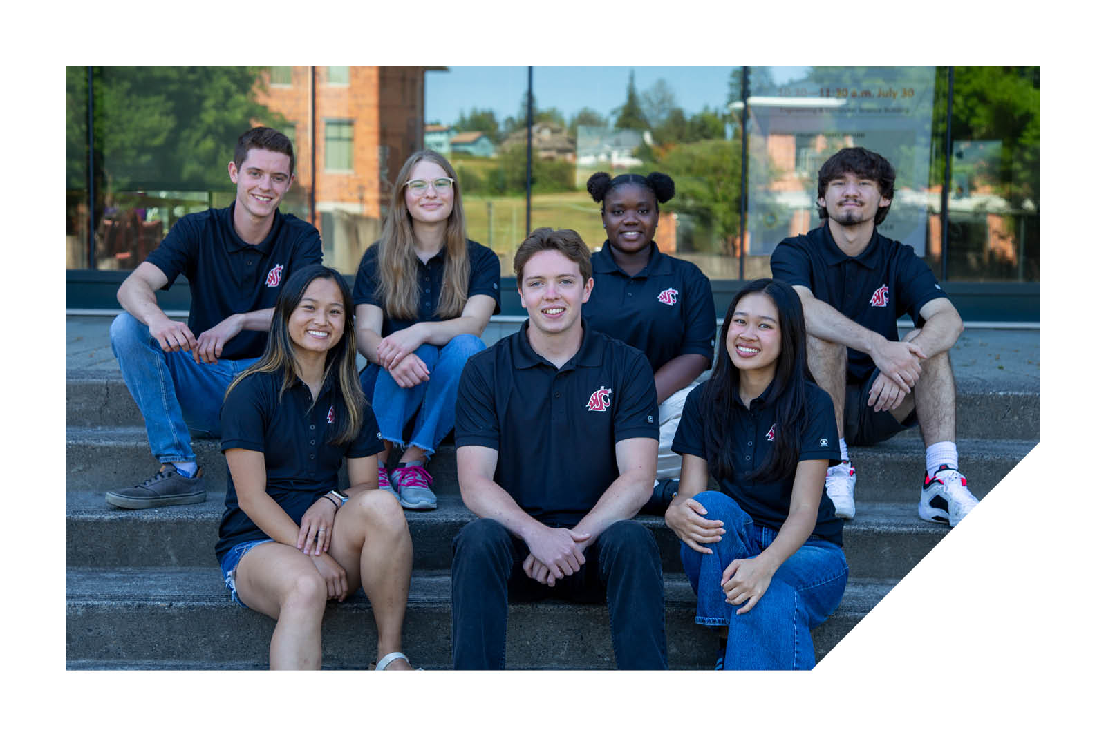 Ambassadors sitting on library steps