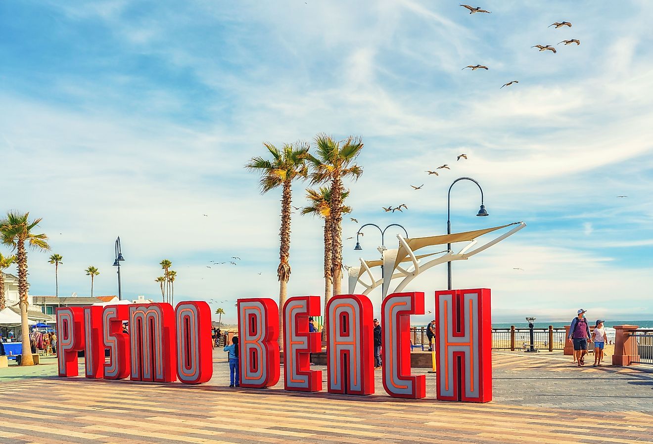 Pismo Beach Pier plaza. The large light-up letters, a new neon landmark of Pismo Beach city, California. Image credit HannaTor via Shutterstock.