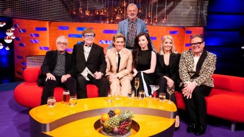 Graham Norton with guests Robert De Niro, Elton John, Brandy Carlisle, Mikey Madison, Alan Carr and Holly Willoughby.