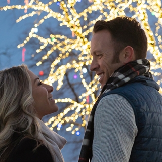 Couple in front of Tree of Light.